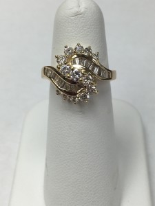 14K Yellow Gold Sparkly Round & Baguette S Ring Size 6.5 1.05 ct Round and .70 ct baguettes Original Price: $2350 Sale Price: $1599