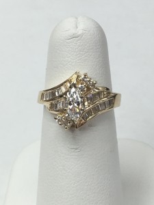 14K Yellow Gold Marquise and Baguette Wedding Ring Size 6 .43 ct Marquise .78 ct Baguettes Original Price: $3899 Sale Price: $1899 